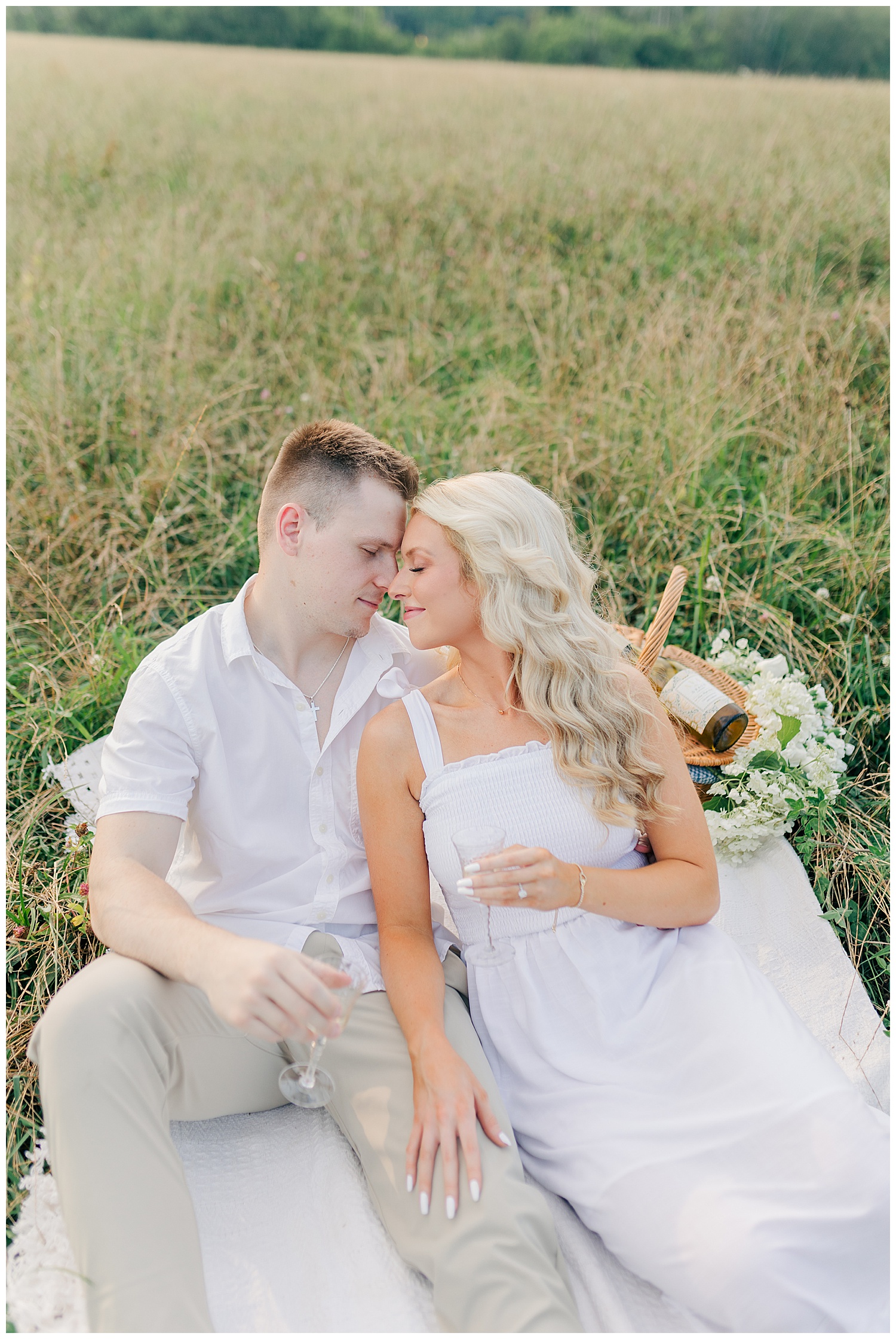 Sweet embraces between a couple at their classic picnic engagement session in West Virginia