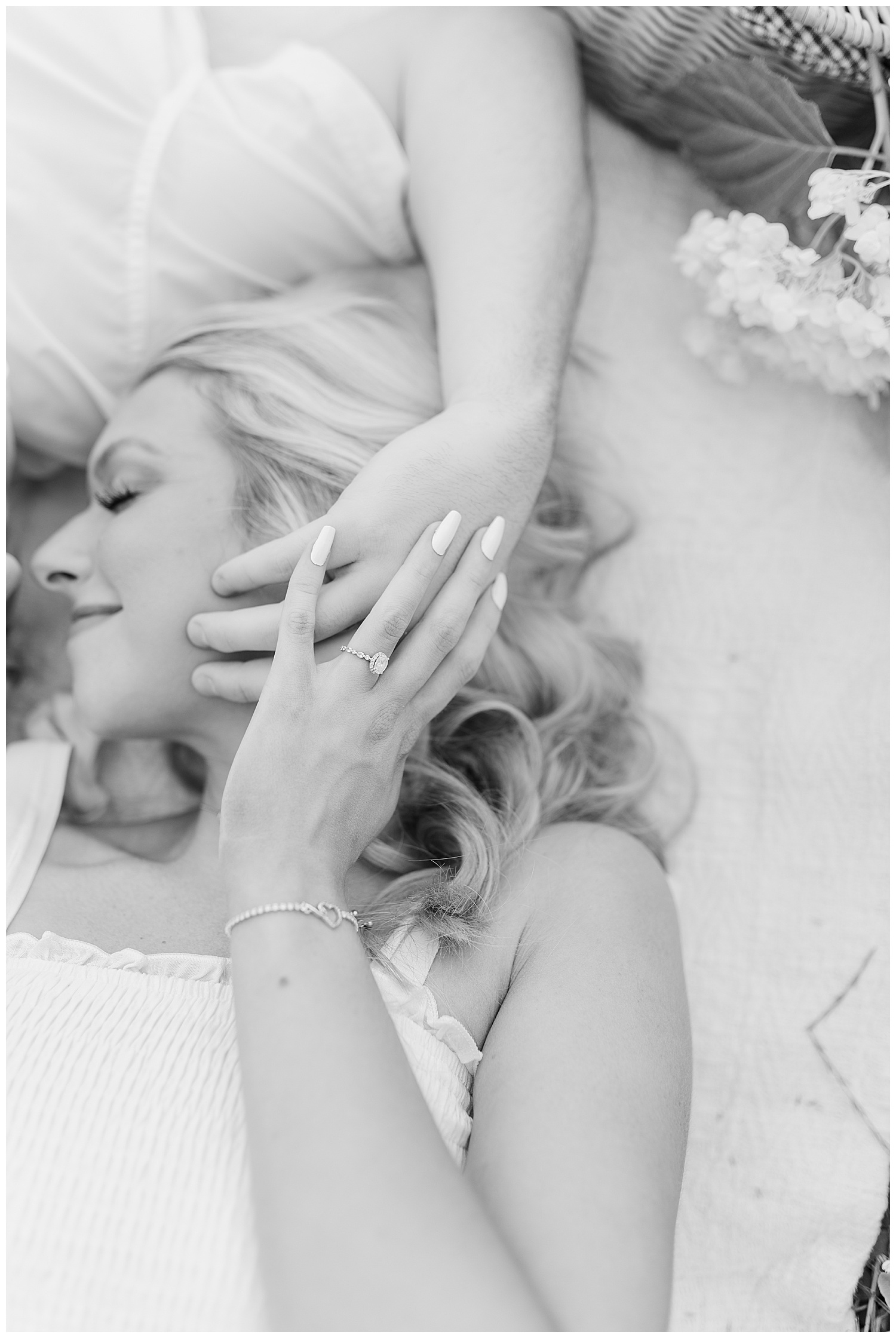 Sweet embraces between a couple at their classic picnic engagement session in West Virginia