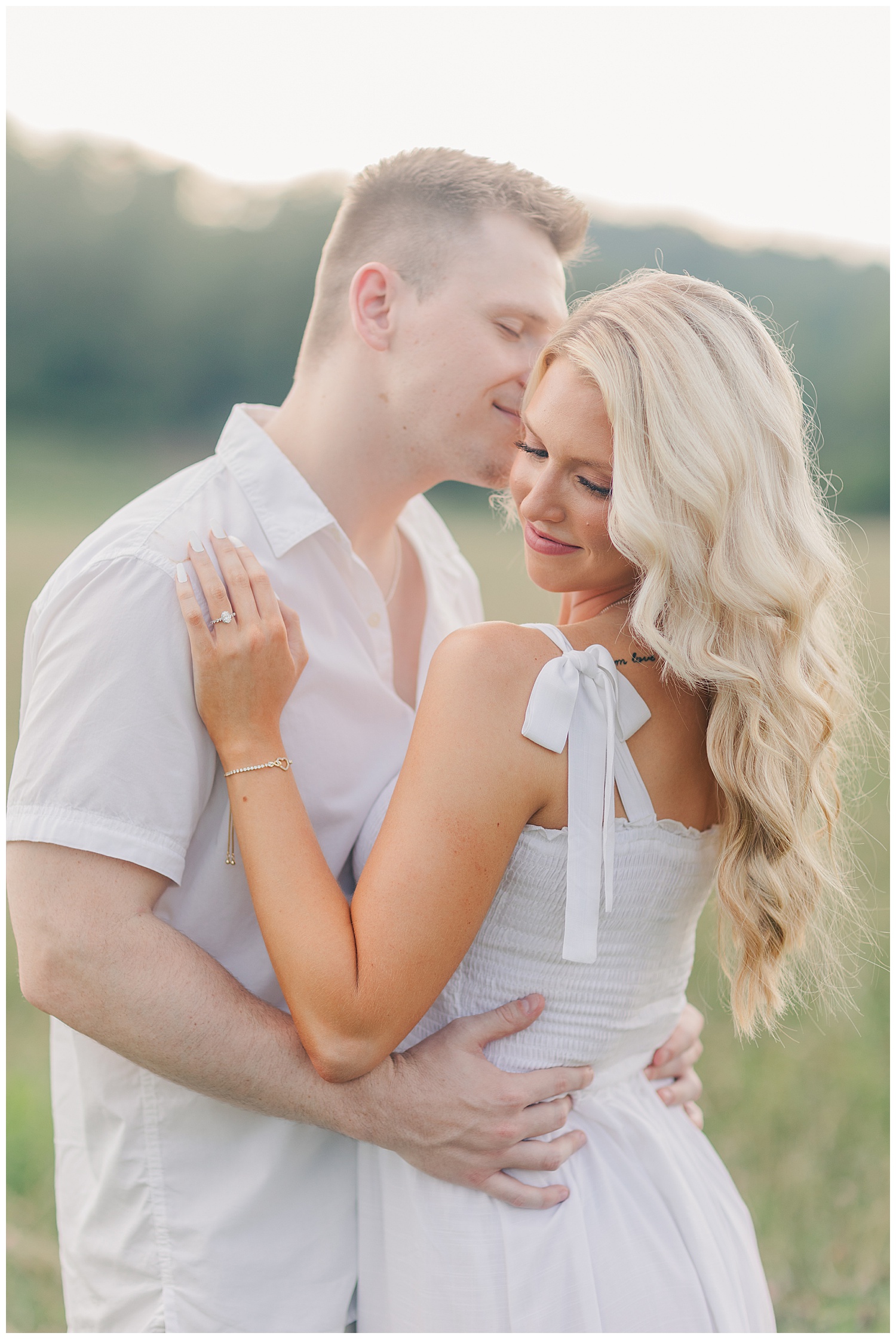 Sweet moments between a couple at their classic picnic engagement session in West Virginia