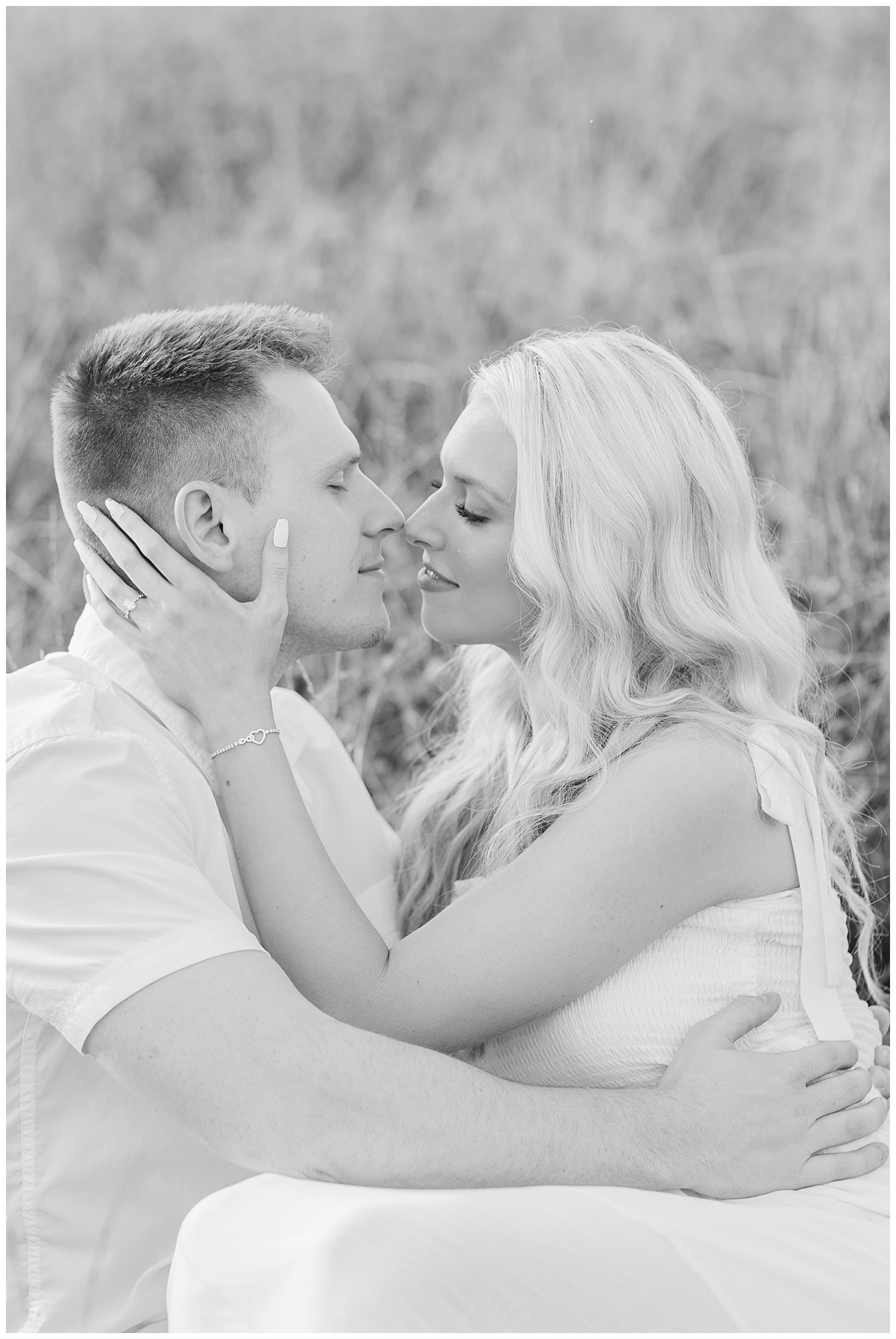 Sweet embraces between a couple at their classic picnic engagement session in West Virginia