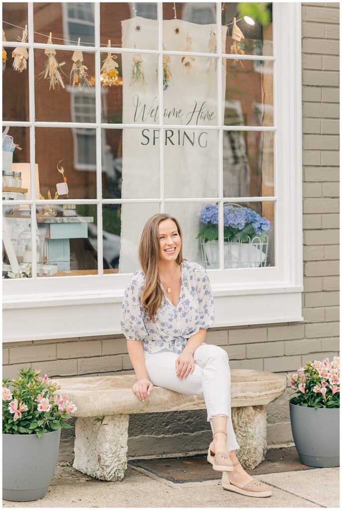 Amanda, owner of Sweet Home Vanilla, smiling proudly inside her retail shop in Thomas, West Virginia.