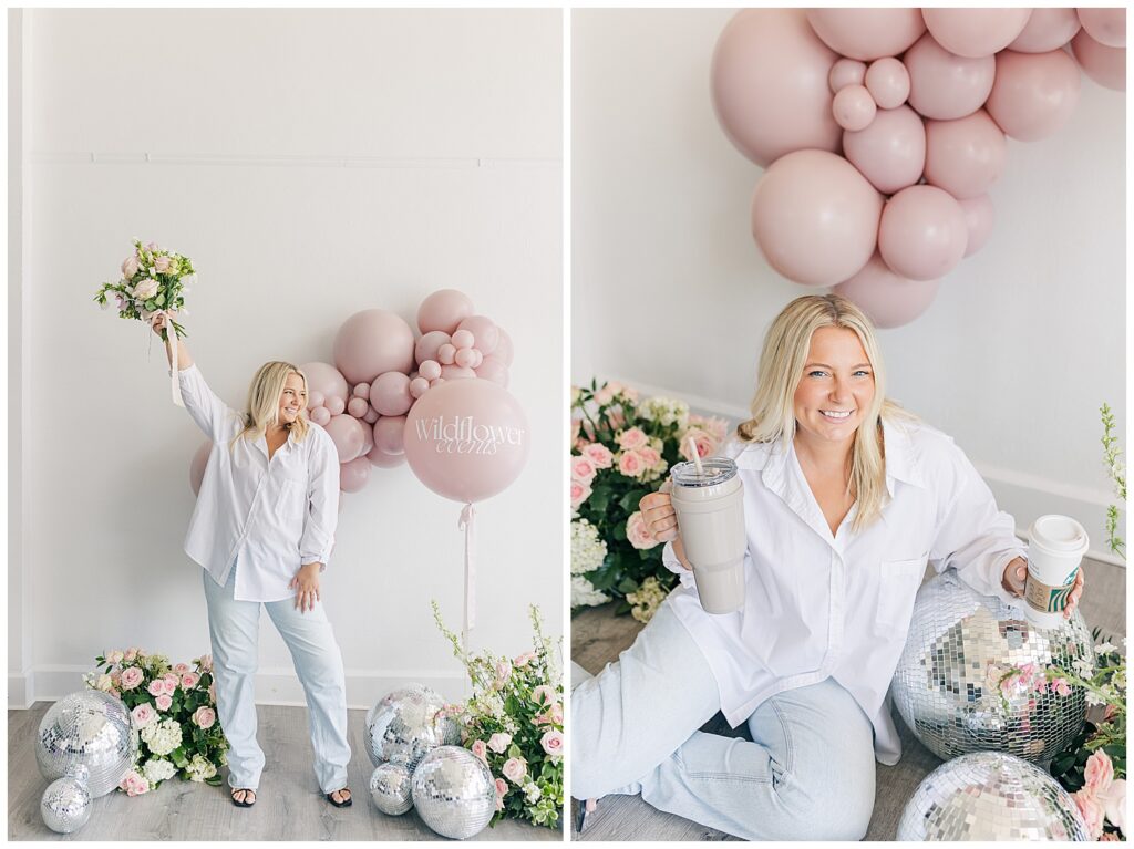 Morgan posing with a celebratory balloon arch, holding a tumbler and smiling while surrounded by florals, embodying the playful and chic aesthetic of Wildflower Events.