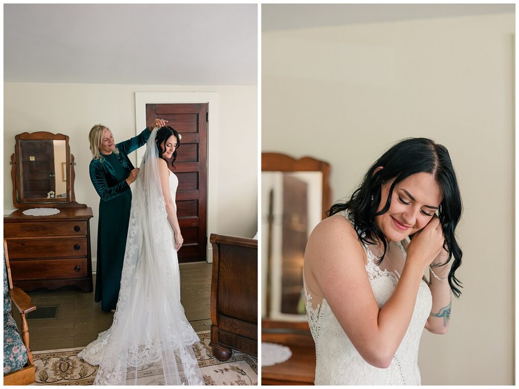 Bride adjusting her veil while smiling, with her mother helping her get ready in a cozy bridal suite.