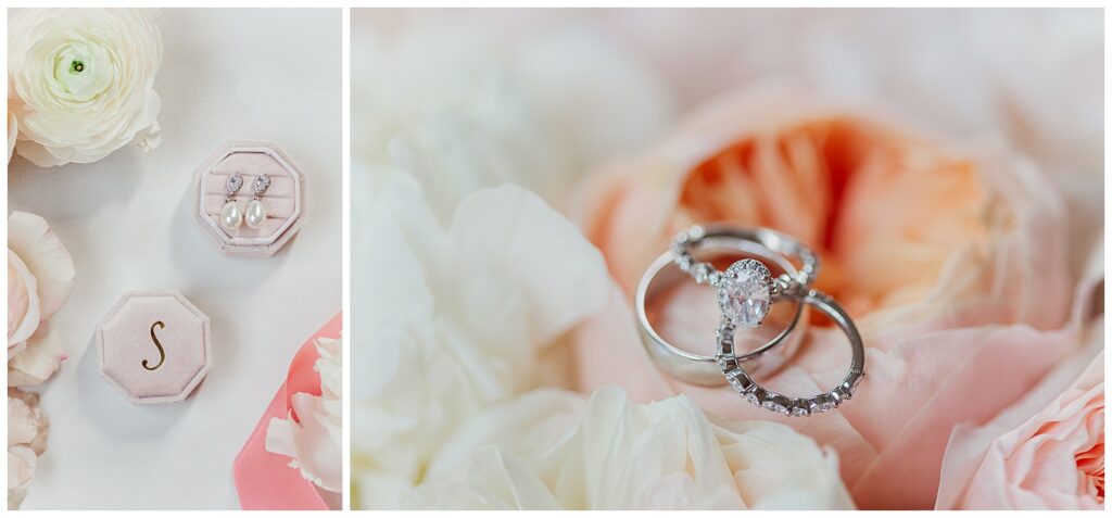 Romantic close-up of wedding rings placed on delicate white and blush florals.