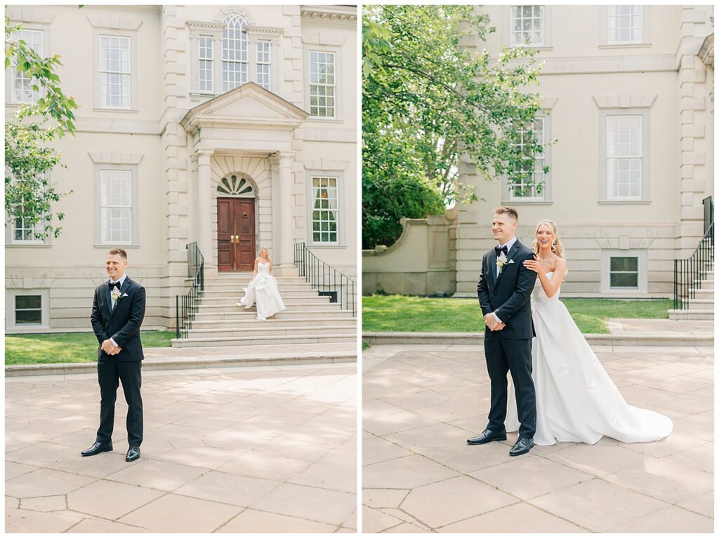 Bride and groom share a joyful first look moment in front of the stately columns and stone architecture of Great Marsh Estate.