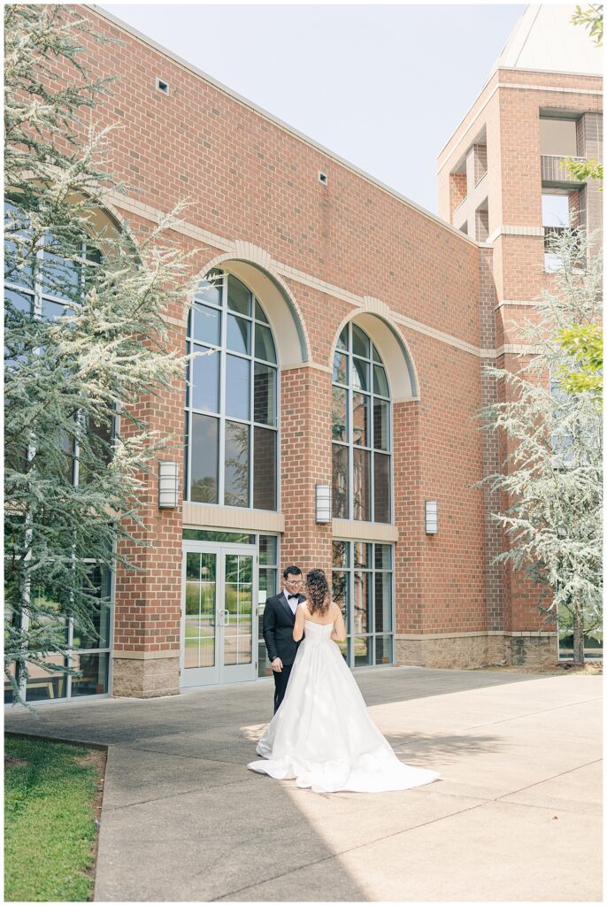 Bride and groom walking together outside Morgantown WV wedding venue — Zoe Evans Photography