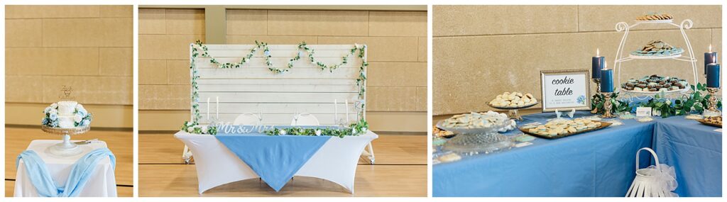 Wide shot of dessert and cookie table styled with soft blue tablecloth and greenery