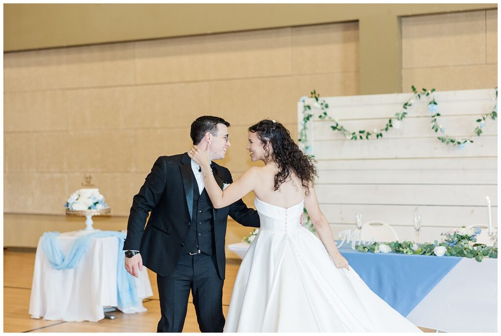 Bride and groom playfully dancing during their wedding reception — Zoe Evans Photography