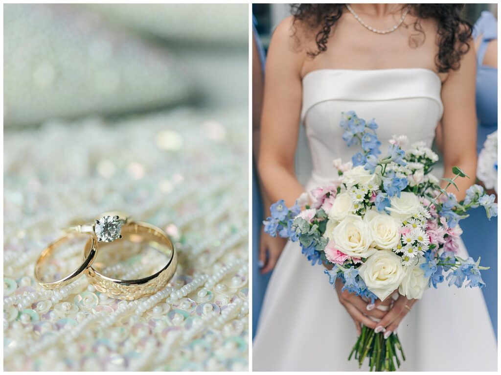 Close-up of wedding rings on a glittery surface with Bride holding a pastel bouquet featuring roses and blue delphinium