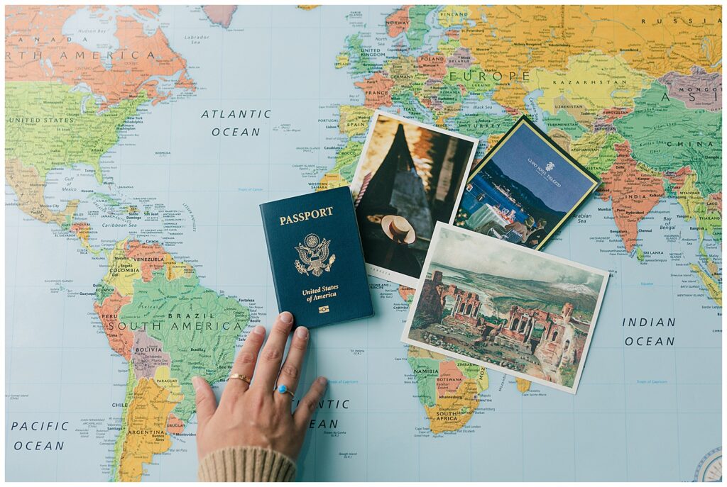 Flatlay brand image featuring a world map, U.S. passport, and travel postcards—highlighting Lauren’s global travel planning services, photographed by Zoe Evans Photography.
