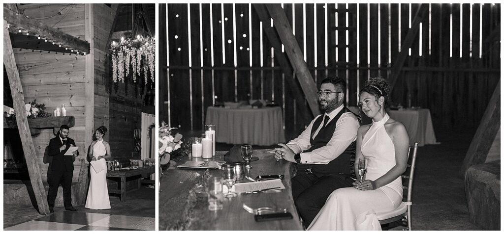 Black and white photo of the groom seated at the sweetheart table during the reception, smiling at a toast
