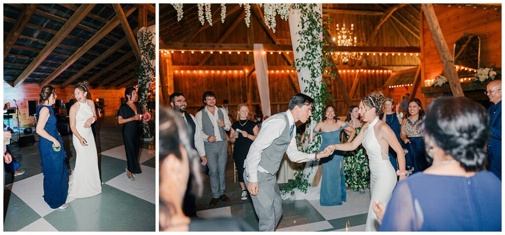 Guests laughing and dancing inside a rustic barn lit with string lights during a lively wedding reception – Zoe Evans Wedding Photography