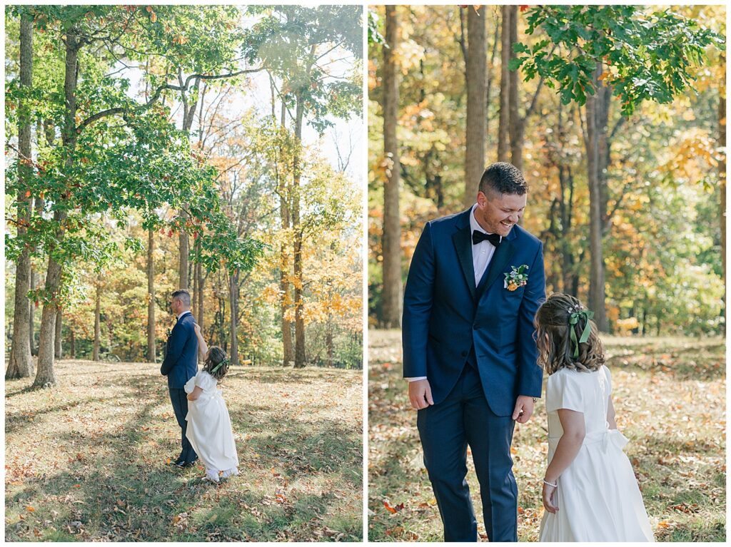 Groom walking hand-in-hand with daughter in white dress through the woods.