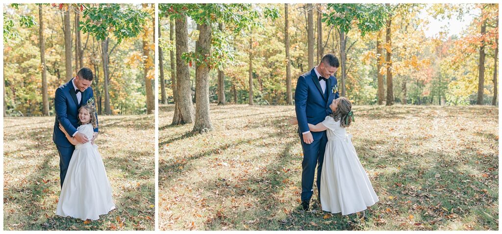 Groom smiling at young daughter during father-daughter first look moment in the woods.