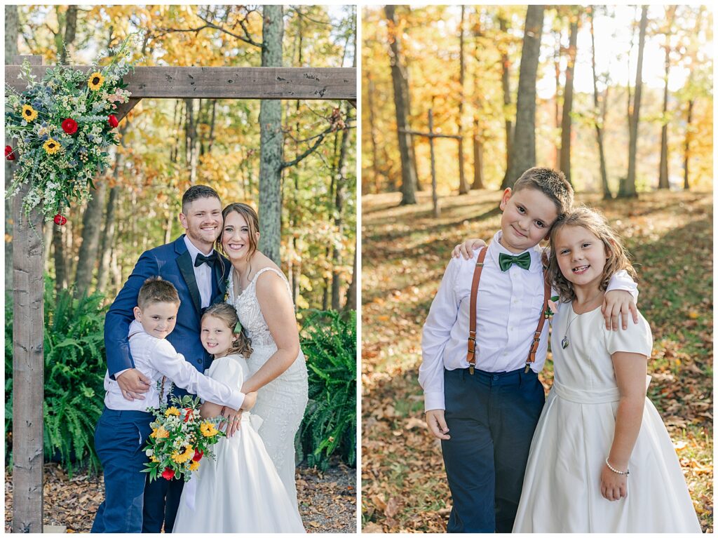 Family portrait with bride, groom, and two children smiling joyfully beneath a wooden ceremony arch draped in florals.