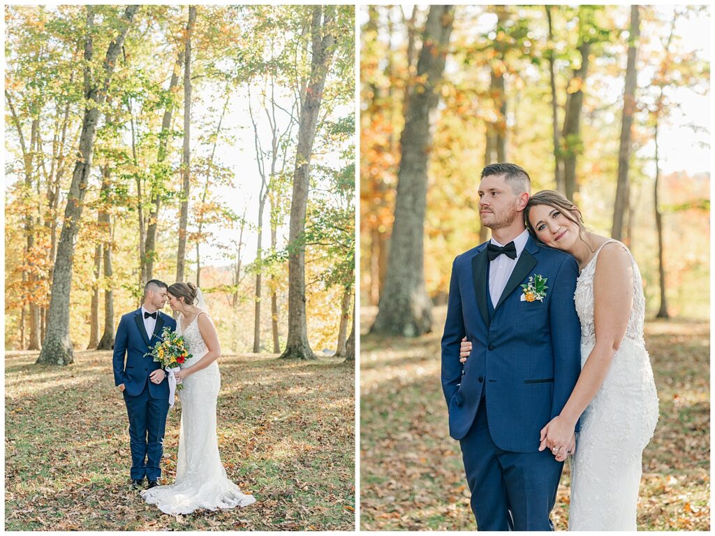 Newlyweds standing close, bride leaning her head on groom’s shoulder in a peaceful wooded area with golden fall leaves.
