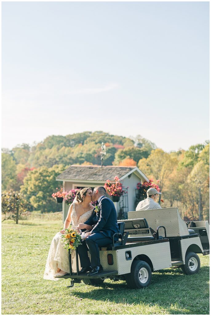 Bride and groom seated in a vintage white Jeep during golden hour, looking out over rolling hills at Athena Estate & Vineyard.
