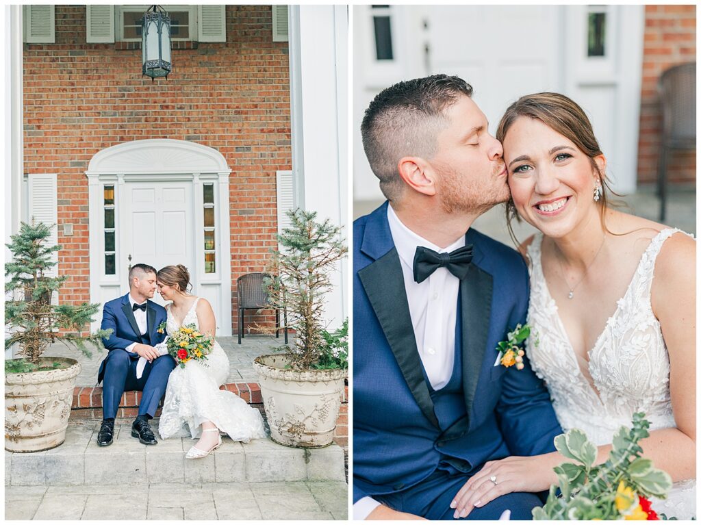Groom kisses bride’s cheek as she beams with joy during portraits in front of the estate’s brick façade.