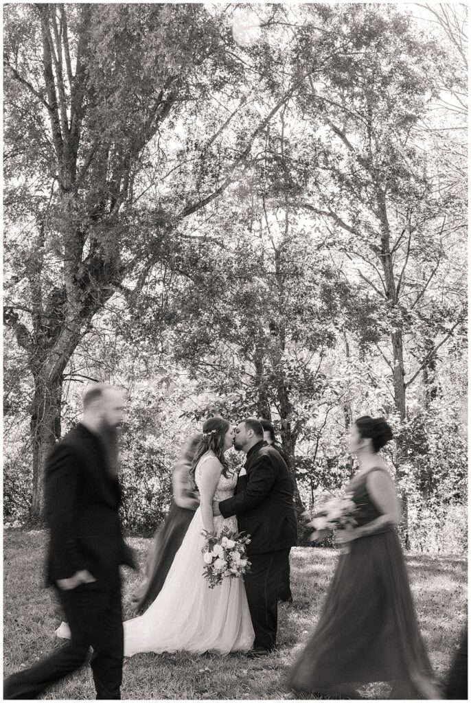 Wedding ceremony seating with wooden chairs and floral accents at Ellis House, photographed by Zoe Evans Photography.