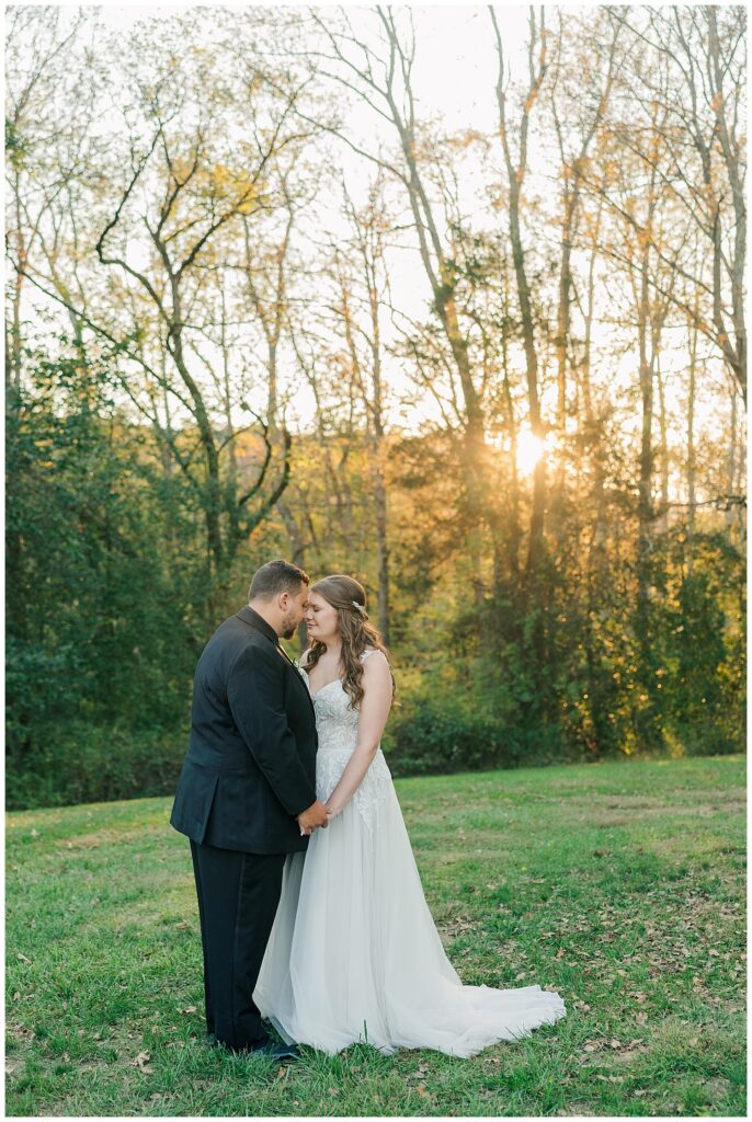 Bride and groom share an intimate moment as the sun sets behind them at Ellis House Maryland, by Zoe Evans Photography.