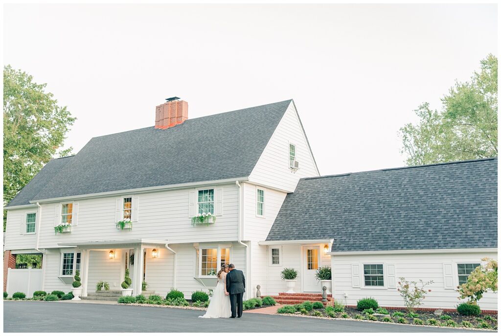Elegant exterior of Ellis House wedding venue in Maryland, lit beautifully during golden hour, captured by Zoe Evans Photography.