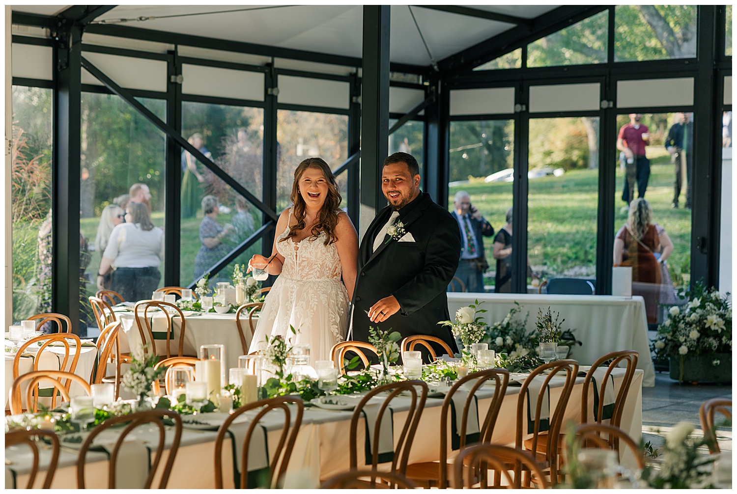 Bride and groom joyfully entering their reception space at Ellis House Fairmont West Virginia, captured by Zoe Evans Photography.