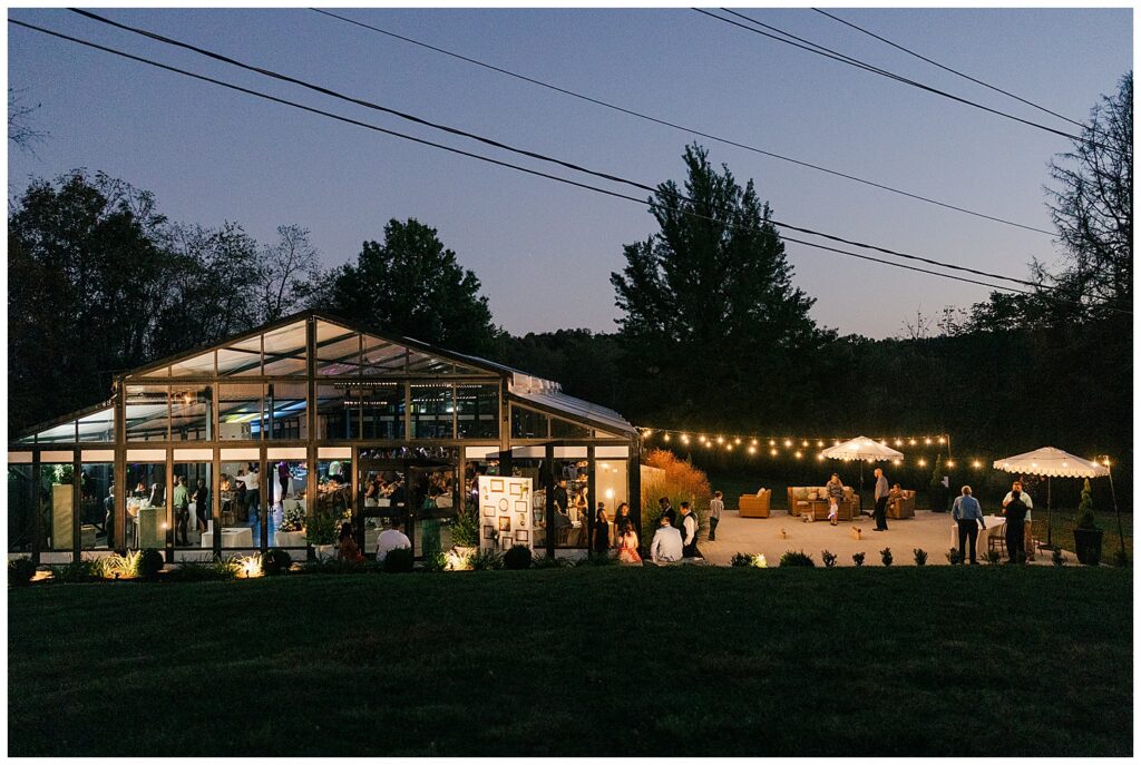 Romantic outdoor view of Ellis House Maryland reception space glowing at night, photographed by Zoe Evans Photography.
