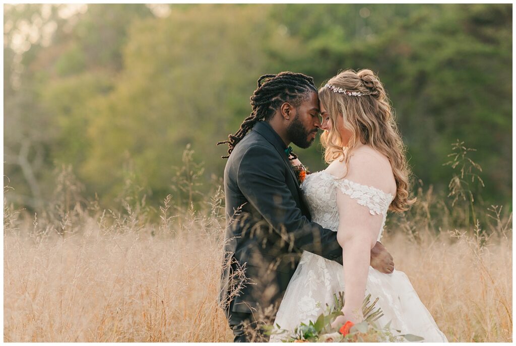 Bride and groom share an intimate moment during sunset portraits at Palomino Pastures in Ritchie County, West Virginia. Captured by Zoe Evans Photography.