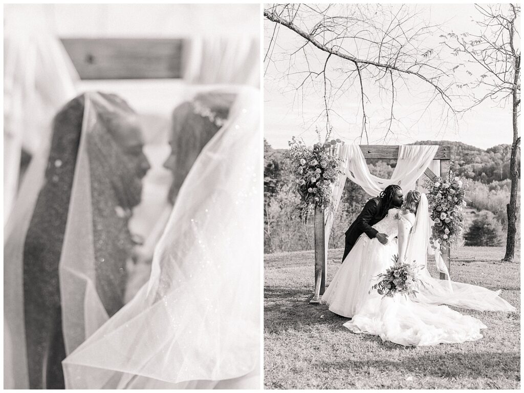 Black and white romantic wedding portrait of bride and groom sharing a quiet moment under the bride’s veil at Palomino Pastures in Ritchie County, West Virginia. Bride and groom kiss beneath a floral ceremony arch during their outdoor wedding at Palomino Pastures, a scenic West Virginia venue.