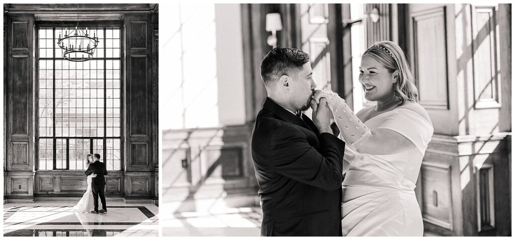 Black-and-white photo of groom kissing bride’s hand on city steps.