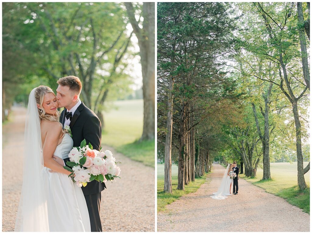 Bride and groom walking down a tree-lined path holding hands, surrounded by greenery.