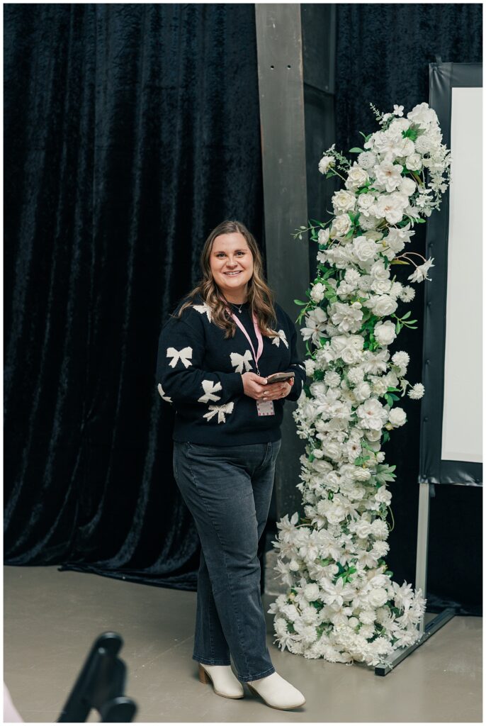 Brand photographer speaking at event about brand photos for small business and closing the visibility gap.