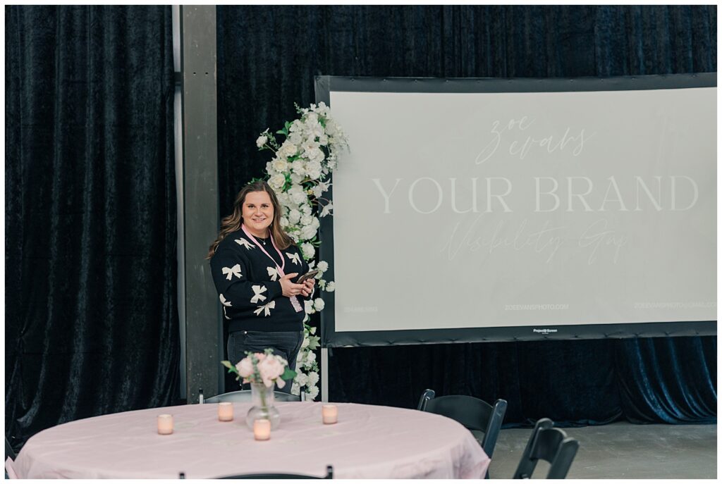 Styled table setup with florals, candles, and connection cards at a branding event for women small business owners.