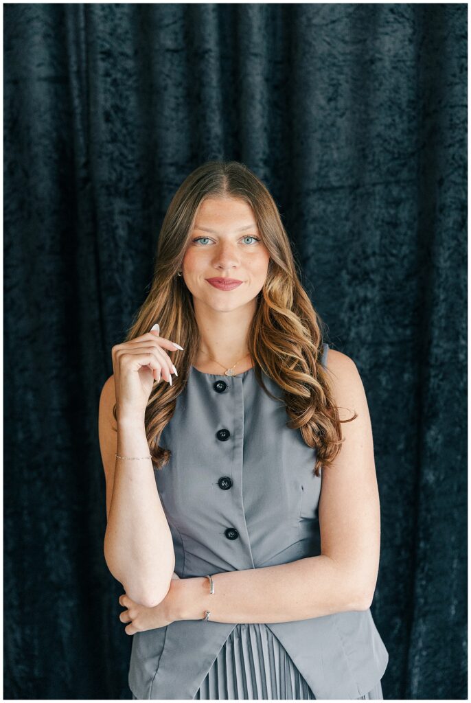 Professional branding headshot of a young female team member in a gray dress at The Onyx Room West Virginia for Brittany Ann’s Events team branding session in Morgantown WV