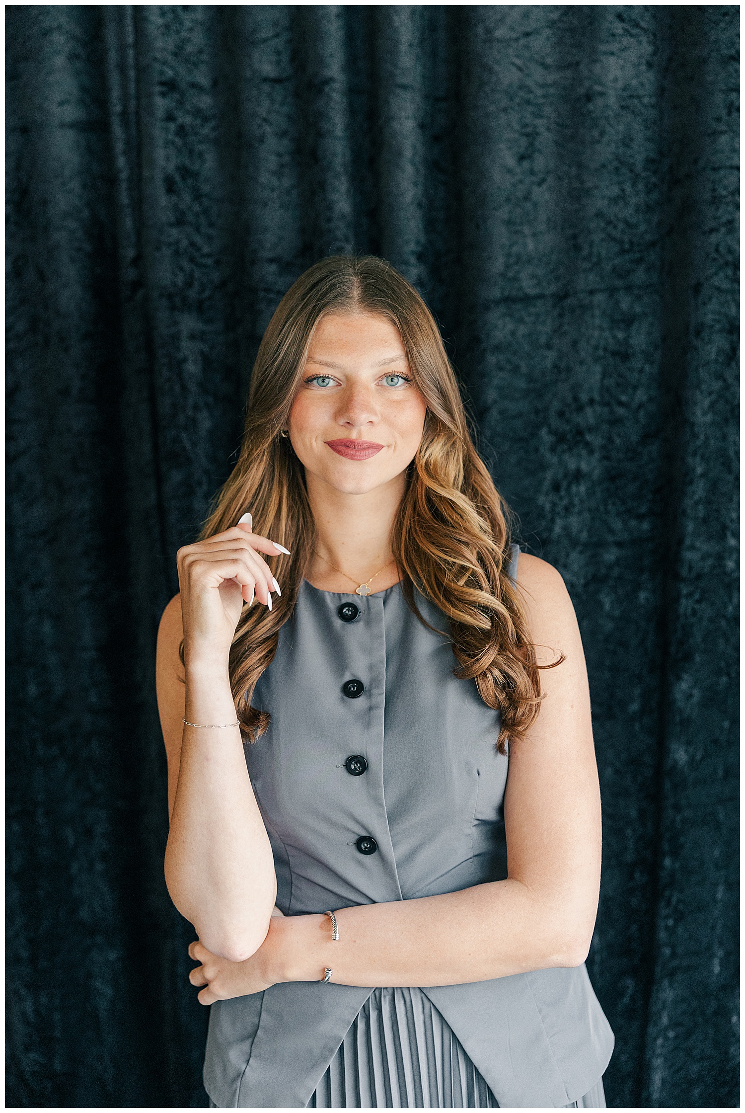 Professional branding headshot of a young female team member in a gray dress at The Onyx Room West Virginia for Brittany Ann’s Events team branding session in Morgantown WV